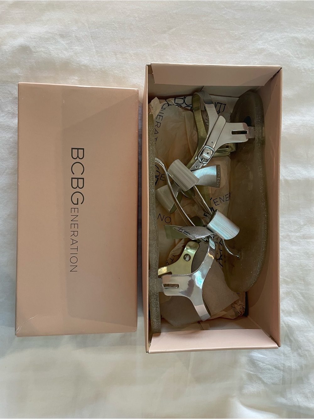 BCBGeneration Metallic Silver Bow Women’s Sandals